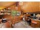Charming office with vaulted ceilings, natural light, and custom wood paneling at 239 Aspen Pl, Evergreen, CO 80439