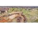 Aerial view of community, highlighting walking paths, lush green spaces, and natural surroundings at 9538 W San Juan Cir # 104, Littleton, CO 80128
