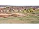 Aerial view of community with scenic walking paths, lush green spaces and natural landscapes at 9538 W San Juan Cir # 104, Littleton, CO 80128