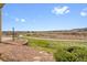 Expansive backyard view overlooking walking path and open field with mountain views in the distance at 9538 W San Juan Cir # 104, Littleton, CO 80128