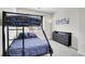 Bedroom features bunk beds, dresser, and wall decor at 9538 W San Juan Cir # 104, Littleton, CO 80128