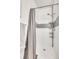 Shower with decorative tile and shower curtain at 9538 W San Juan Cir # 104, Littleton, CO 80128