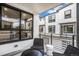 Cozy outdoor balcony with comfortable seating area, ideal for enjoying neighborhood views at 2036 S Holly St # 1, Denver, CO 80222