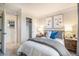 Bedroom with artwork and closet at 2036 S Holly St # 1, Denver, CO 80222