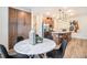 Well-lit dining area and kitchen combo with plenty of cabinet space and an airy feel at 2036 S Holly St # 1, Denver, CO 80222