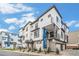 Modern townhome exterior with a stylish facade, balconies, and well-maintained landscaping at 2036 S Holly St # 1, Denver, CO 80222