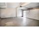 Spacious garage with high ceilings and ample room for vehicle parking and storage at 2036 S Holly St # 1, Denver, CO 80222