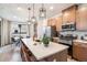 Modern kitchen with stainless appliances, sleek cabinetry, and a large center island at 2036 S Holly St # 1, Denver, CO 80222
