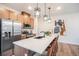 Modern kitchen featuring stainless steel appliances and a large island with barstool seating at 2036 S Holly St # 1, Denver, CO 80222