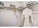 Functional walk in closet with shelving and rod for hanging clothes at 2036 S Holly St # 1, Denver, CO 80222