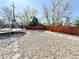 Large backyard with a trampoline and a fence at 8590 Faraday St, Denver, CO 80229