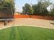 Large backyard with artificial turf, a stone ground cover, and a trampoline at 8590 Faraday St, Denver, CO 80229