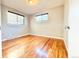This bedroom has hardwood floors and windows to let in natural light at 8590 Faraday St, Denver, CO 80229
