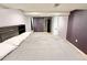 Bedroom with neutral carpet and purple accent wall at 8590 Faraday St, Denver, CO 80229