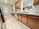 Functional kitchen with stainless steel appliances, tile flooring, and plenty of cabinets at 8590 Faraday St, Denver, CO 80229