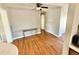 Spacious living room featuring hardwood floors, ceiling fan and natural light at 8590 Faraday St, Denver, CO 80229