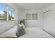 Bright bedroom featuring a large window, closet, and neutral decor that creates a peaceful and inviting atmosphere at 7830 Ladore St, Commerce City, CO 80022