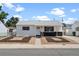 Charming home exterior featuring updated landscaping, fresh paint, and a cozy front porch at 7830 Ladore St, Commerce City, CO 80022