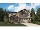 Charming two-story home with stone accents, a covered porch and an attached two-car garage at 24970 E 42Nd Ave, Aurora, CO 80019