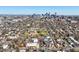 Expansive aerial view showcasing the Denver skyline, surrounded by neighborhoods and green spaces at 117 Elati St # 1, Denver, CO 80223