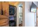 This compact bathroom is conveniently located near the modern in-unit washer and dryer at 117 Elati St # 1, Denver, CO 80223