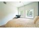 A light and airy bedroom provides a spacious area for relaxing and working from home at 117 Elati St # 1, Denver, CO 80223