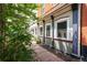 Detailed side view showcasing window trim and outdoor planters, accentuating the property's charm and character at 117 Elati St # 1, Denver, CO 80223
