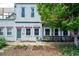 Charming home exterior featuring a well-maintained front yard, flowering plants, and a welcoming entrance at 117 Elati St # 1, Denver, CO 80223