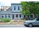 Inviting home exterior with charming architectural details, a well-manicured yard, and a classic car at 117 Elati St # 1, Denver, CO 80223