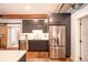 Modern kitchen features stainless steel appliances, sleek gray cabinetry, and an open design at 117 Elati St # 1, Denver, CO 80223