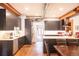 Modern kitchen with stainless steel appliances, gray cabinetry, stone countertops, and updated fixtures at 117 Elati St # 1, Denver, CO 80223