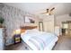 Comfortable main bedroom featuring minimalist decor and a modern ceiling fan at 117 Elati St # 1, Denver, CO 80223