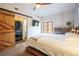 Spacious main bedroom featuring an en-suite laundry area and private balcony at 117 Elati St # 1, Denver, CO 80223