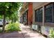 Street view capturing the home's facade and neighborhood charm, enhanced by lush greenery and sidewalk appeal at 117 Elati St # 1, Denver, CO 80223