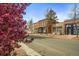 Inviting street view featuring classic brick buildings with blooming trees and a quaint neighborhood at 117 Elati St # 1, Denver, CO 80223