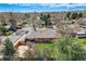 Home featuring a spacious backyard, wooden fence, mature trees, and a well-maintained lawn from an aerial perspective at 6773 E Baker Pl, Denver, CO 80224
