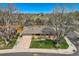 Charming home featuring mature trees, a well-manicured lawn, and a classic brick exterior at 6773 E Baker Pl, Denver, CO 80224