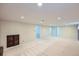 Open basement area with neutral carpet, and recessed lighting, offering versatile space for recreation and relaxation at 6773 E Baker Pl, Denver, CO 80224