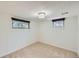 Bright bedroom with neutral carpet and natural light, featuring a clean and simple design for rest and relaxation at 6773 E Baker Pl, Denver, CO 80224