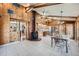 Open floor plan with wood paneled walls and ceilings. Features a rustic wood stove and tile floors at 6773 E Baker Pl, Denver, CO 80224