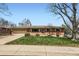 Charming brick home with a well-maintained lawn and an attached two-car garage at 6773 E Baker Pl, Denver, CO 80224