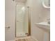 Bathroom with a walk-in shower and pedestal sink at 14936 E Hampden Ave # 202, Aurora, CO 80014