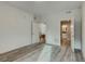 Bright bedroom with hardwood floors and access to a bathroom at 14936 E Hampden Ave # 202, Aurora, CO 80014