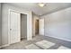 Bedroom with closet and doorway. The floor is carpeted at 899 Winding Brook Dr, Berthoud, CO 80513