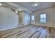 Entryway featuring wood-style flooring, neutral walls, and a staircase to the upper level at 899 Winding Brook Dr, Berthoud, CO 80513