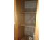 Interior storage closet with wood shelving and concrete walls at 7801 W 35Th Ave # 1, Wheat Ridge, CO 80033