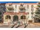 Condo building featuring multiple balconies, and a brick exterior at 7801 W 35Th Ave # 1, Wheat Ridge, CO 80033