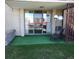 Patio featuring artificial grass and a sign promoting 'For Sale' at 7801 W 35Th Ave # 1, Wheat Ridge, CO 80033