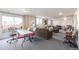 Carpeted living room featuring couches, chairs, and access to balcony at 7801 W 35Th Ave # 1, Wheat Ridge, CO 80033