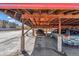 Covered parking space featuring timber wood and concrete columns at 7801 W 35Th Ave # 1, Wheat Ridge, CO 80033
